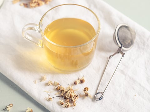 Herbal tea cup on neutral background